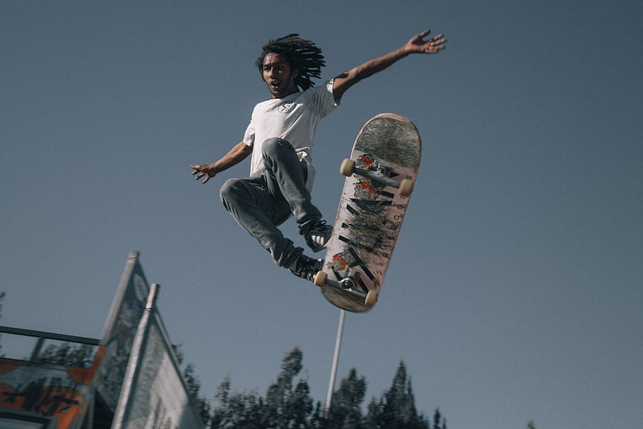man playing with skateboard, action, balancing, boy, extreme