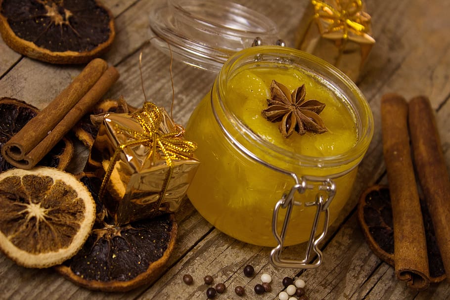 photography of yellow gel candle on brown wooden table, orange HD wallpaper