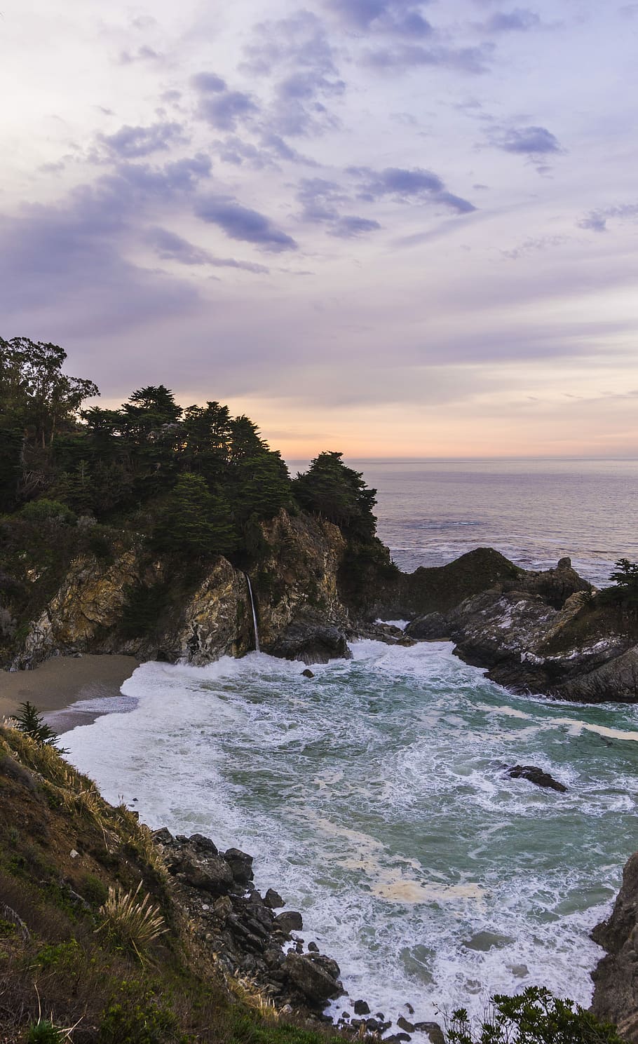 body of water between rock formation, sea waves on beach, sunset HD wallpaper