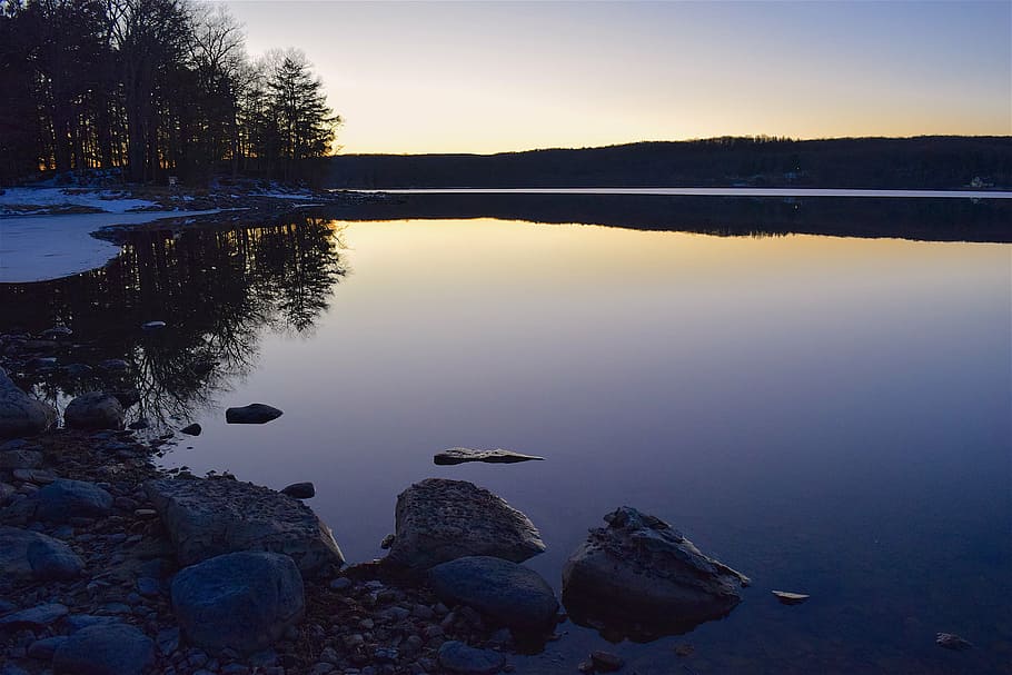 calm body of water near trees, lake, sunset, rock, reflection HD wallpaper