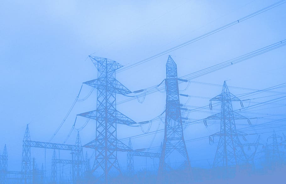 black steel electric posts during fog, pylons, utility poles