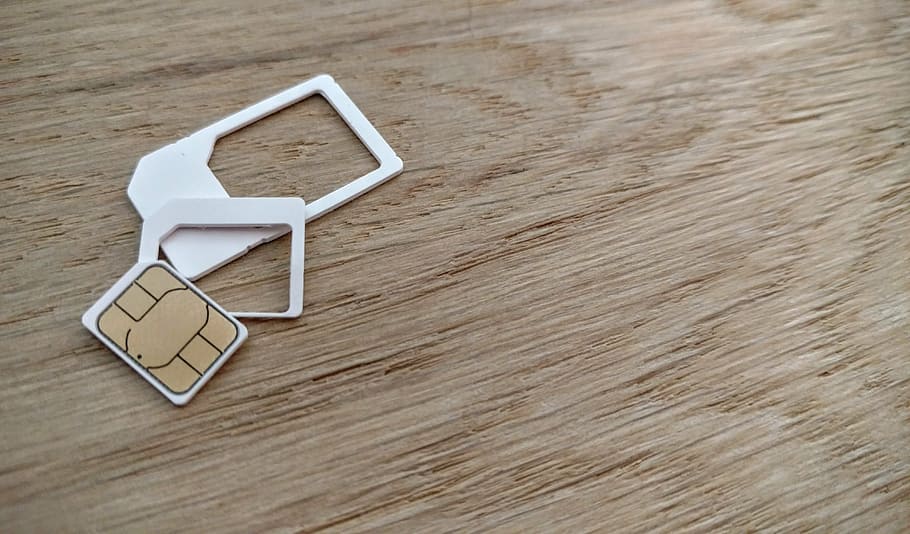 simcard with two white cases, sim card, nano sim, micro sim, mini sim