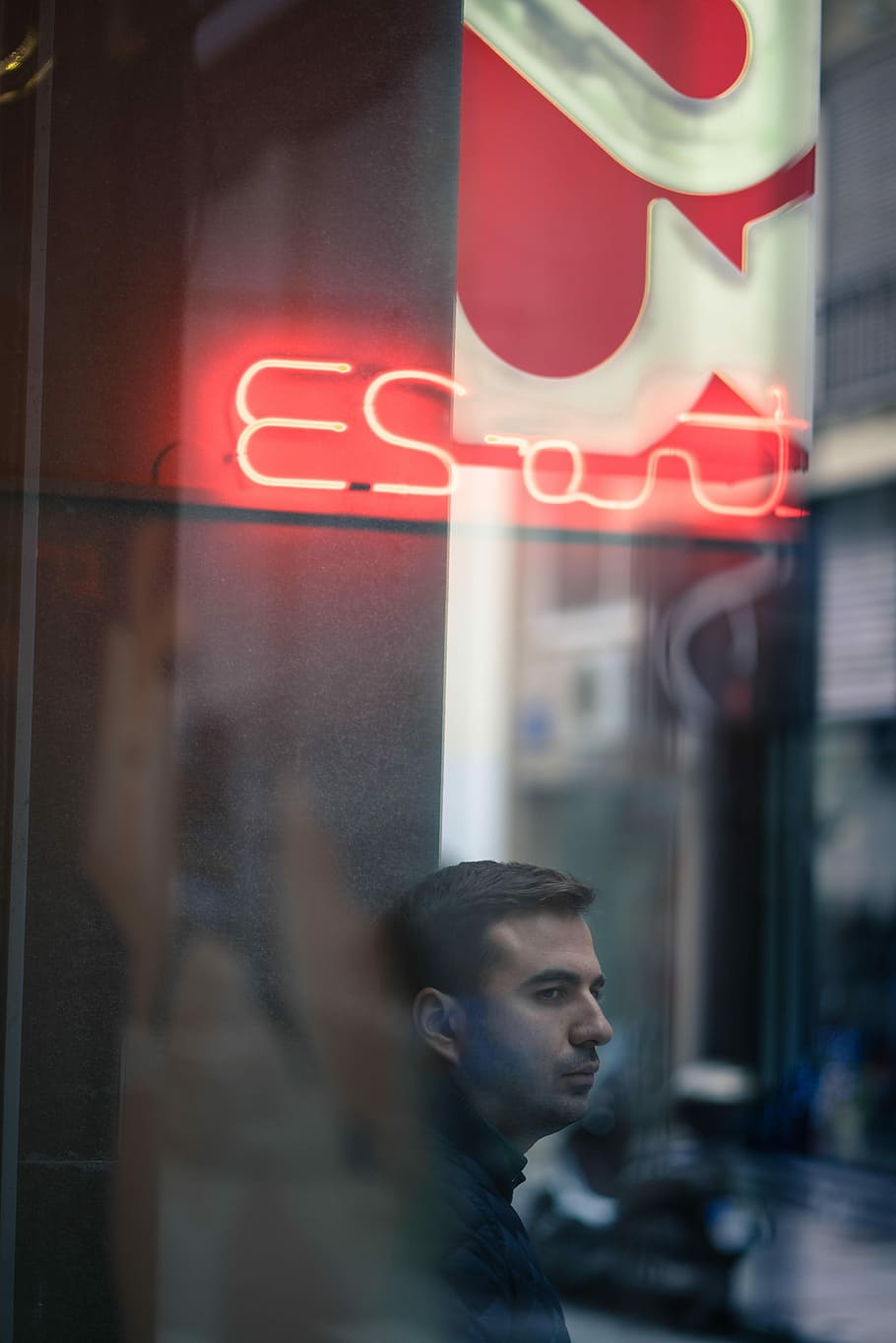 man wearing black jacket standing near signage and building at daytime, untitled HD wallpaper