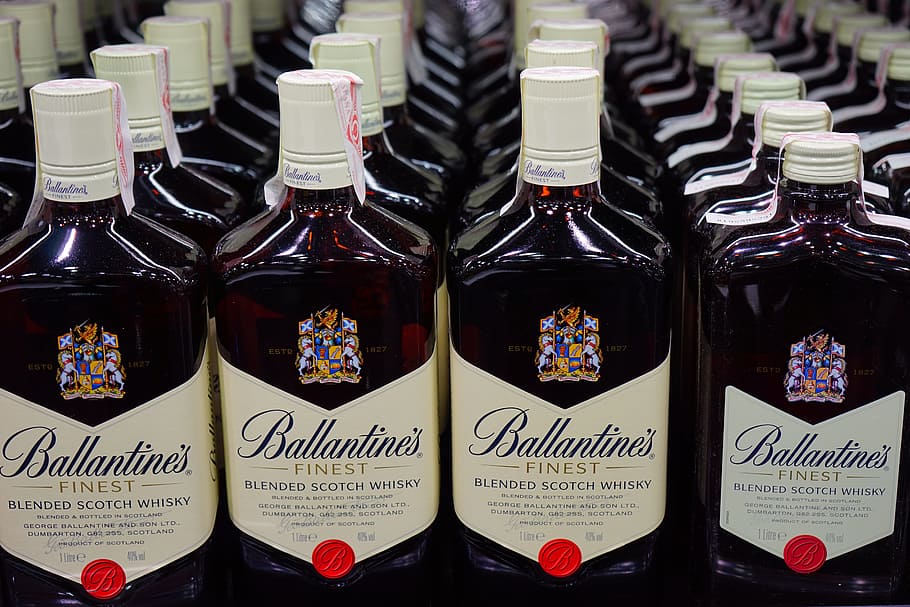 lined up Ballantines Finest Scotch Whiskey bottles, scotch whisky