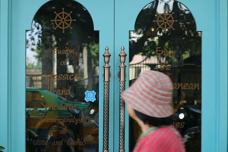 person standing in front of door, restaurant, blue, hat, fusion HD wallpaper