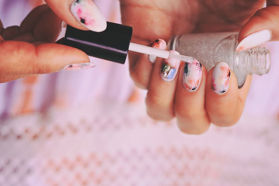 person using nail polish, human Hand, close-up, women, beauty Product HD wallpaper