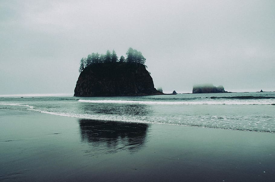 islet on body of water under cloudy sky, landscape photo of island from seashore HD wallpaper