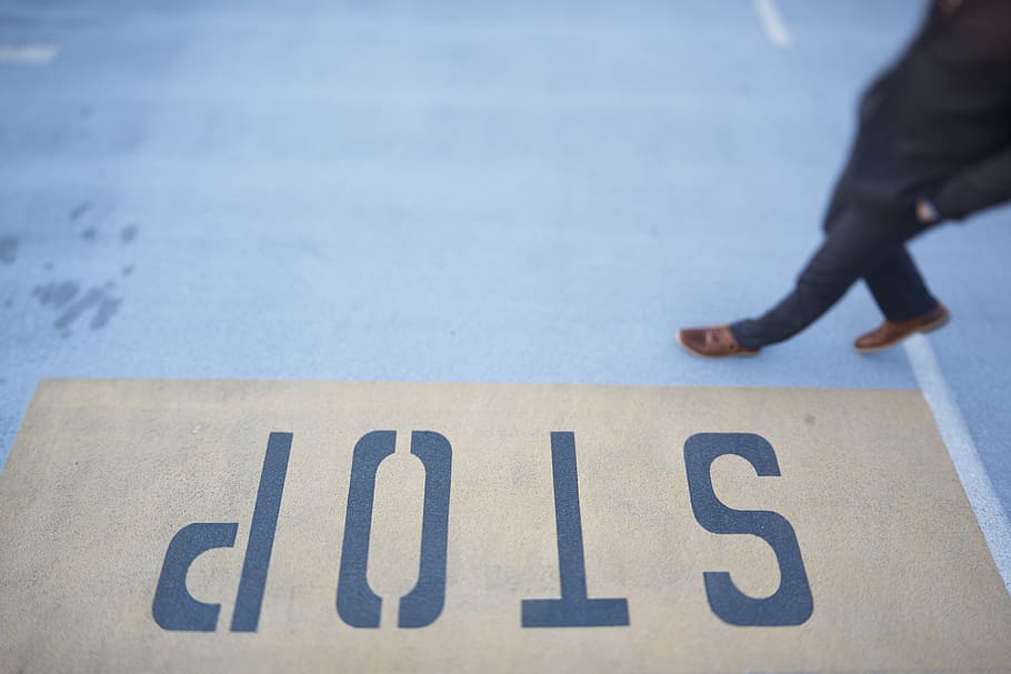 person waling on gray floor, yellow, black, stop, road, lane HD wallpaper