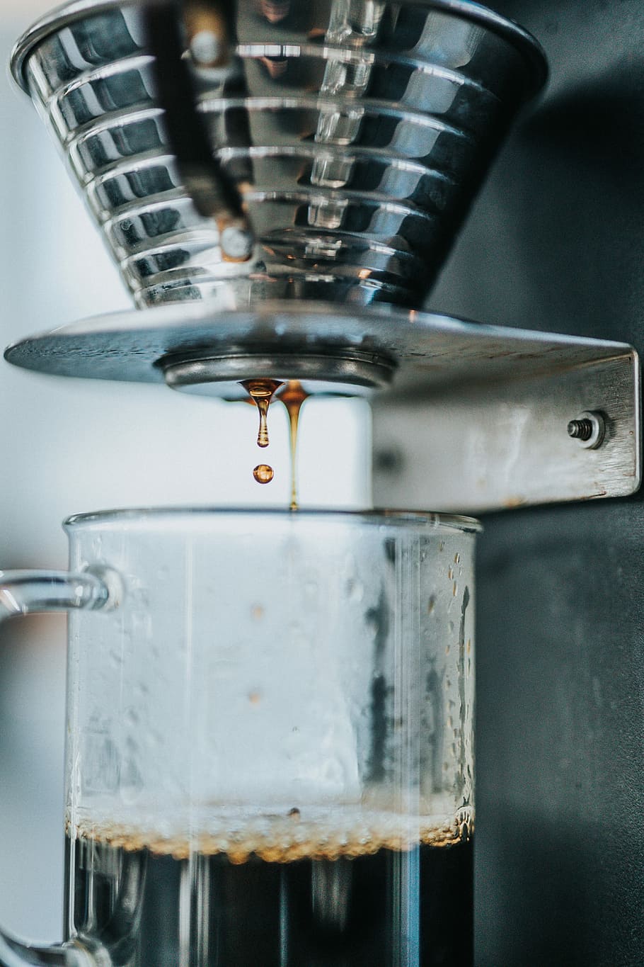 gray steel coffeemaker, shallow focus photography of glass mug filled with coffee HD wallpaper