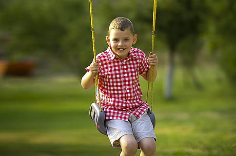 smiling boy sitting on gray swing chair, swinging, playing HD wallpaper