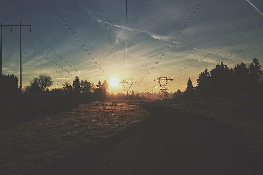 pathway near electric posts, two, gray, transmission, towers HD wallpaper