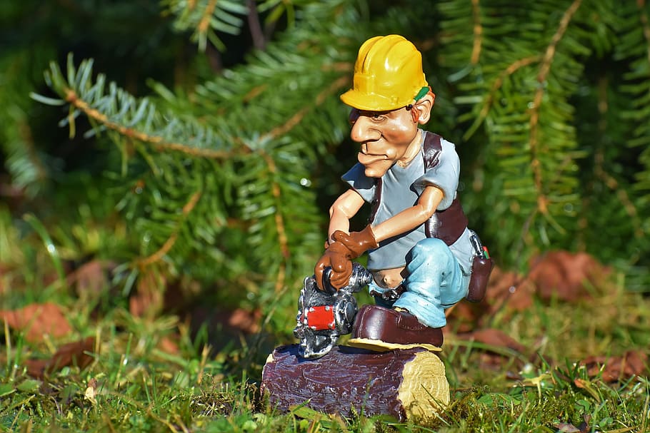 man wearing blue shirt and holding chain saw figurine, lumberjack HD wallpaper