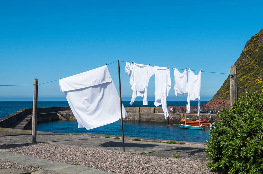 white cloth on the wire, blue, laundry, clothes line, clothes peg