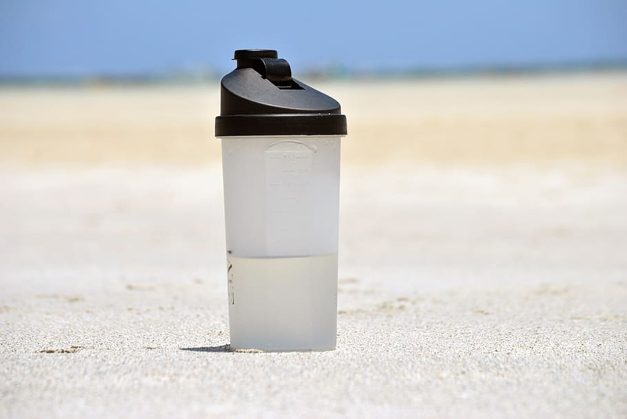tumbler on ground during daytime, bottle, water, plastic, container, HD wallpaper