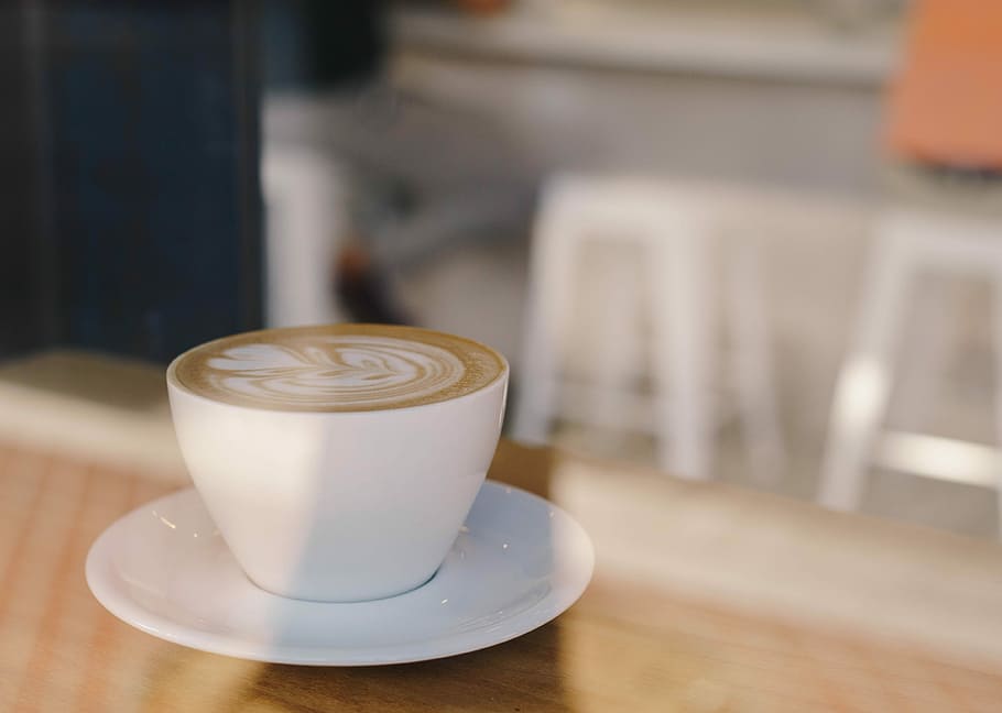 white ceramic mug with coffee in shallow focus lens, white teacup and saucer filled with coffee HD wallpaper