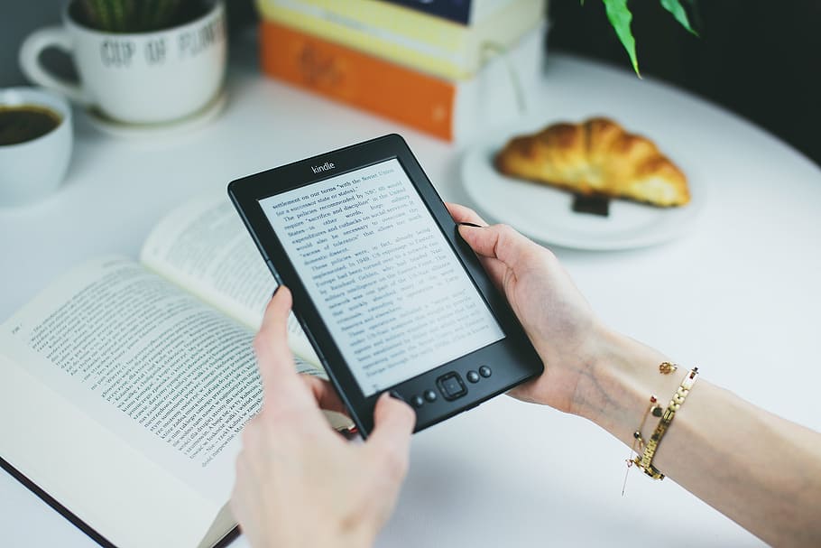 person holding Amazon Kindle e-reader, black, book, reading HD wallpaper