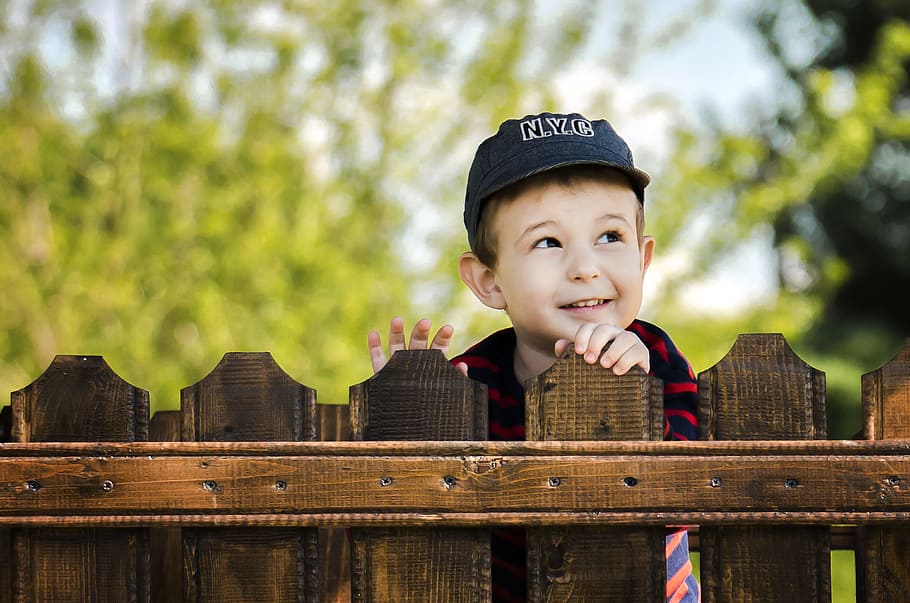 boy wearing black cap standing behind wooden fence, kid, child, HD wallpaper