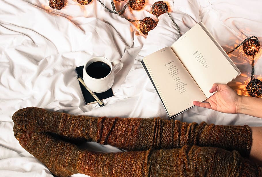 person holding book, coffee, hot, drink, bean, spoon, cup, saucer HD wallpaper
