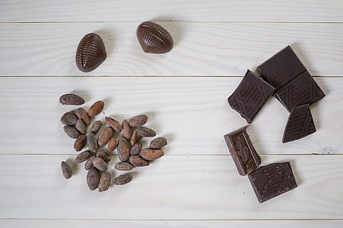 chocolate bar beside peanuts on white wooden surface, Cocoa Beans HD wallpaper