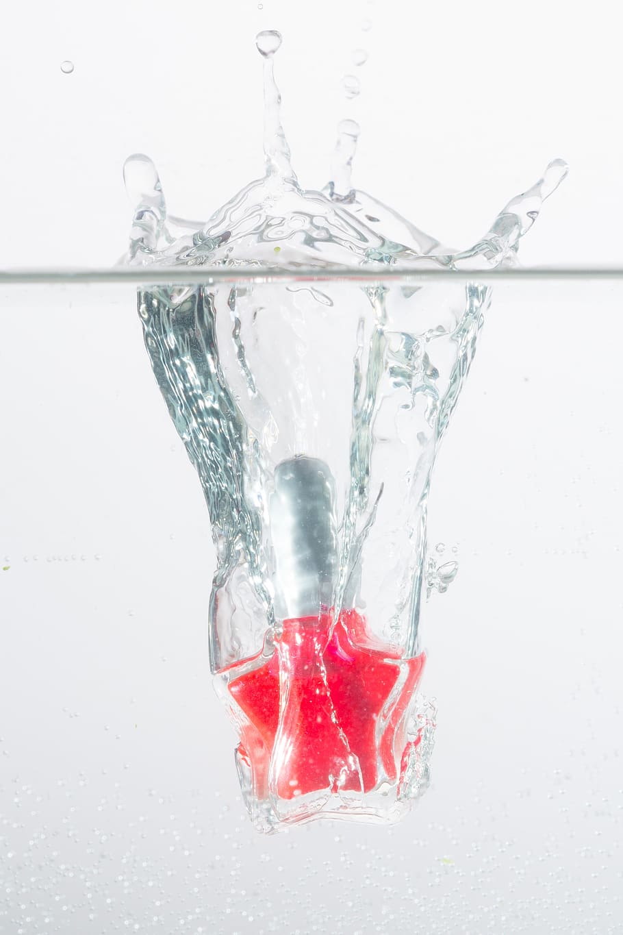 pink bottle dropped on water, inject, red, spray, water splashes HD wallpaper