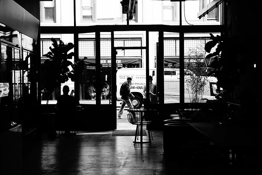 grayscale photo of house and people, man walking near white vehicle HD wallpaper