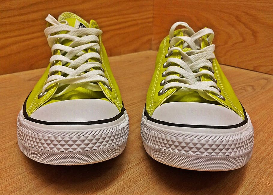 pair of green Converse All-Star low-top sneakers on wooden surface HD wallpaper