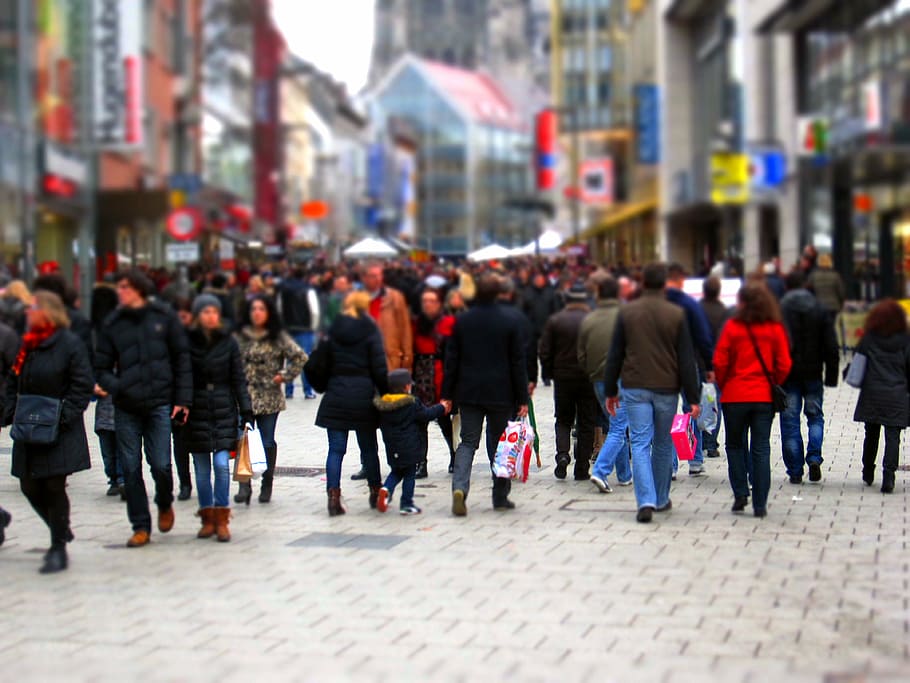 group of people walking on street with bokeh effect, shopping