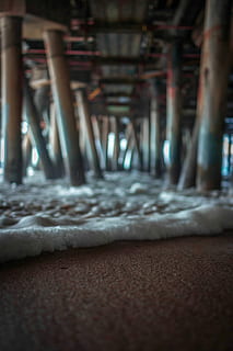 Underneath Santa Monica Pier, sea foam under wooden docks, ocean HD wallpaper