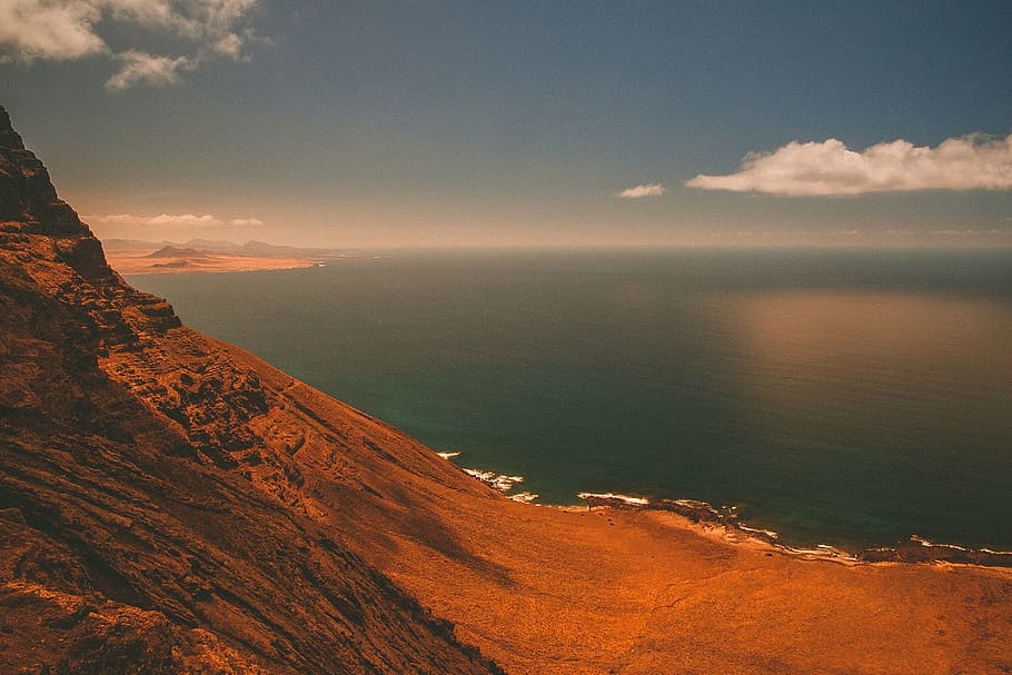 ocean, sea, water, coast, mountains, sky, clouds, shore, hills HD wallpaper