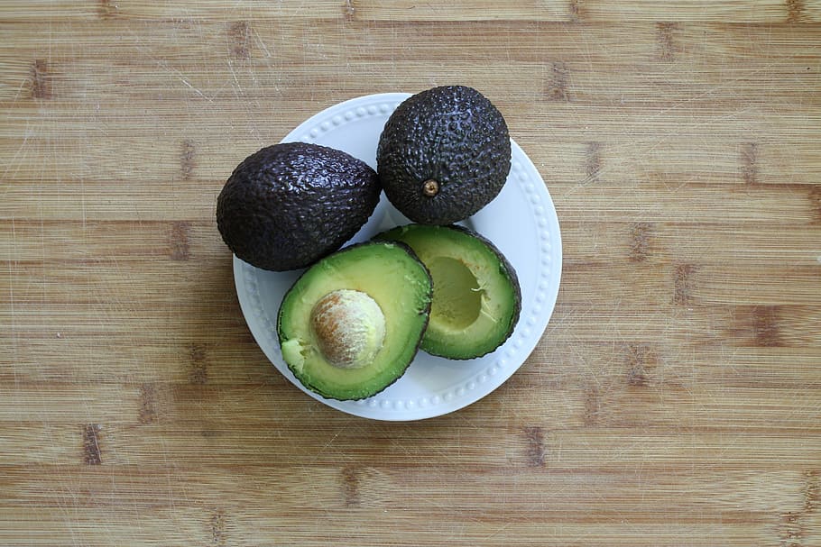 sliced avocado on white ceramic plate, fresh, green, vegetarian HD wallpaper