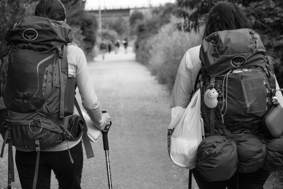 man and woman carrying backpacks, Spain, Santiago, Path, Road HD wallpaper