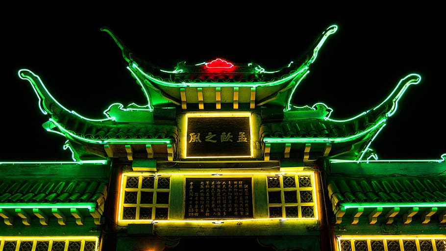 photo of green and yellow shrine, green lighted pagoda temple at nighttime HD wallpaper