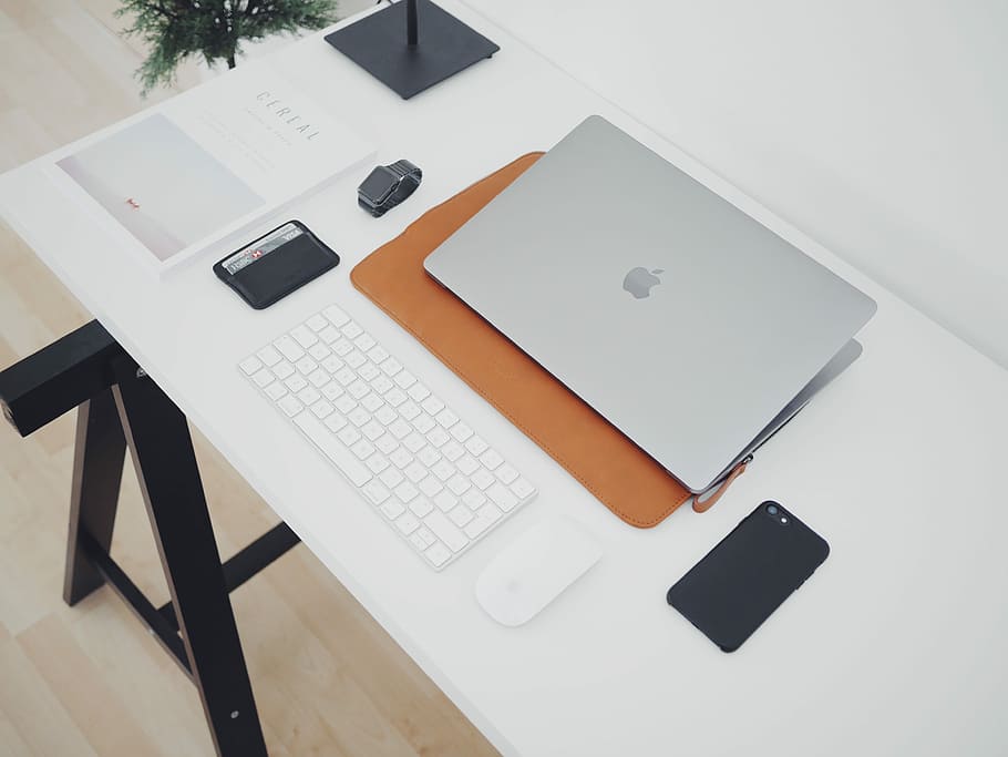 silver MacBook and phone on white table, flat lay photo of silver MacBook near black smartphone and wireless Apple Keyboard, HD wallpaper