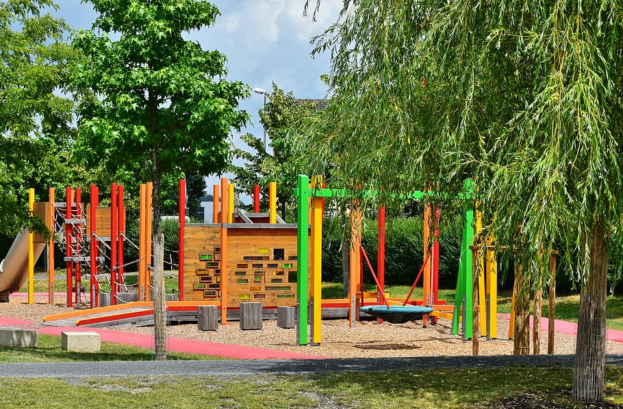 brown and green park near trees, playground, children, children's playground