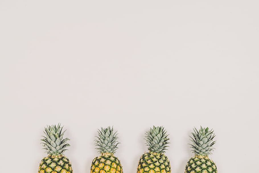 four pineapples on white wall, fruit, white background, copyspace HD wallpaper