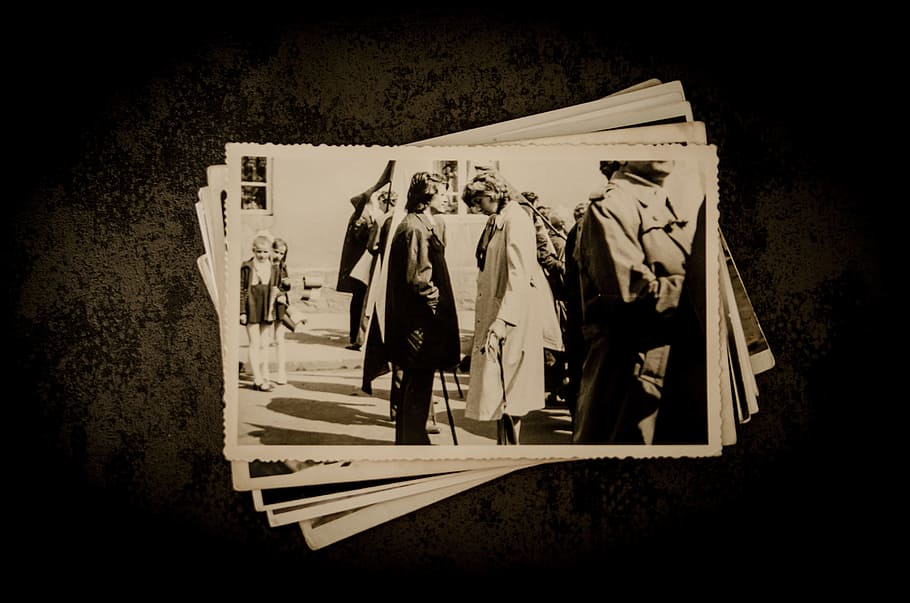 sepia photo of man in front of a woman, photographer, old, photos