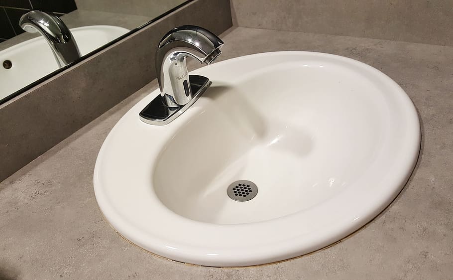 white ceramic sink and silver stainless steel faucet, wash basin