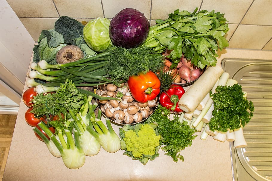 bunch of vegetables on sink, red cabbage, white cabbage, savoy