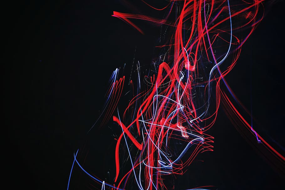 red and blue doodle artwork with black background, red and white light strokes