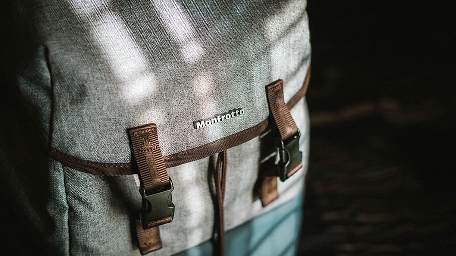 close-up photograph of gray and brown snap backpack, gray Monfrotto backpack HD wallpaper