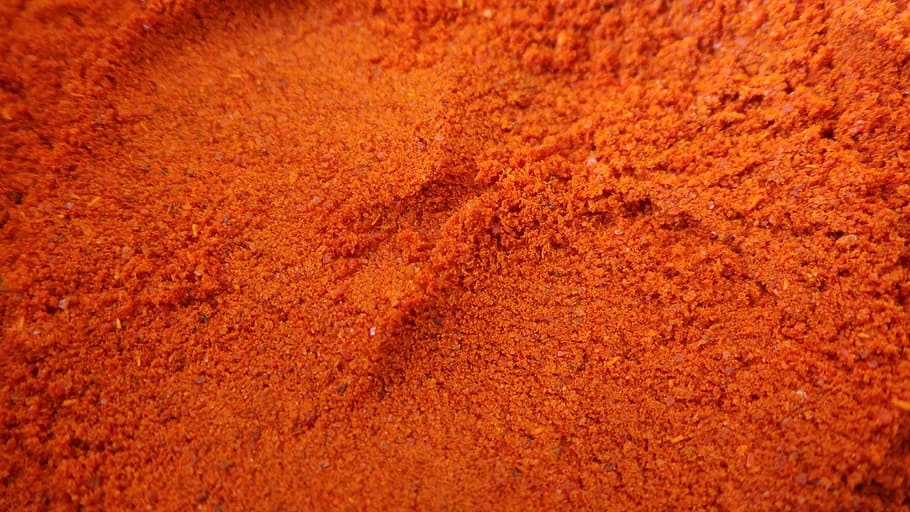 closeup photo of red powders, chili, spice, chili powder, cayenne