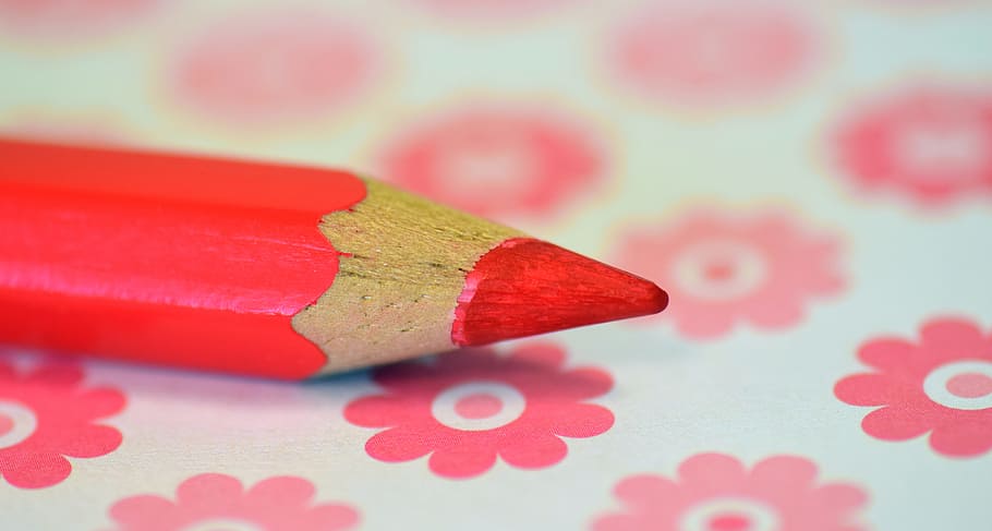 shallow focus photography of red color pencil, wood pen, pink