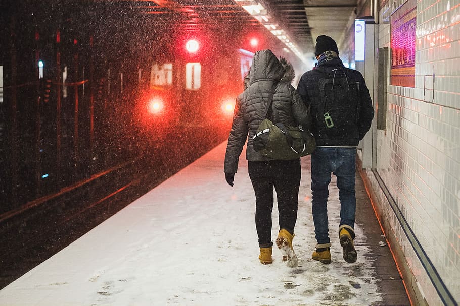 people walking at train station during winter, man and woman standing near train HD wallpaper