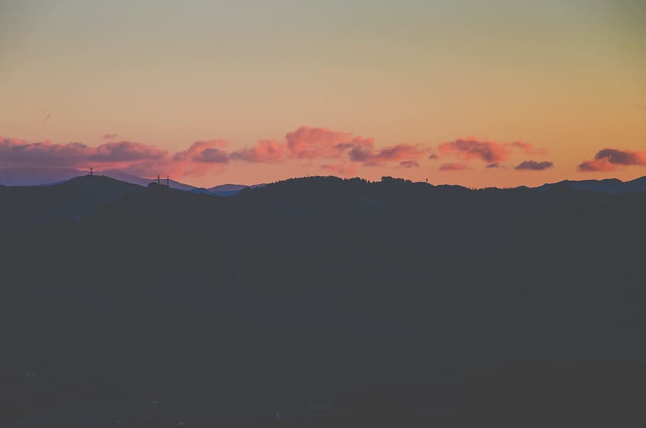 silhouette photography of highlands, silhouette of mountain view during golden hour HD wallpaper