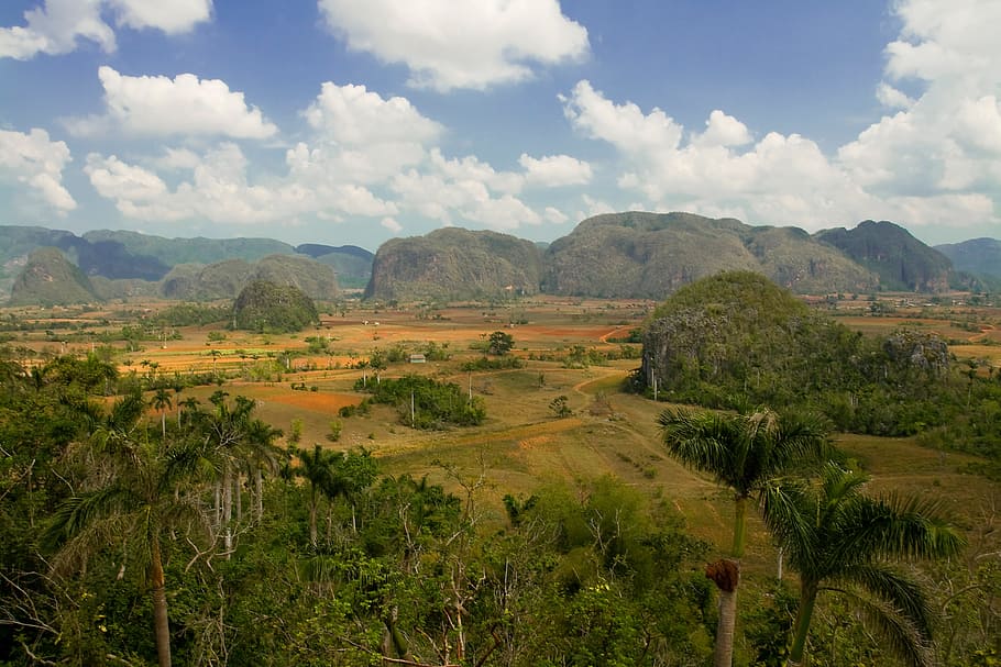 This landscape was taken at Viñales Valley in the Pinar del Río Province of Cuba. With spectacular rock formations and a lush tropical climate, this area was named a UNESCO World Heritage Site in 1999 HD wallpaper