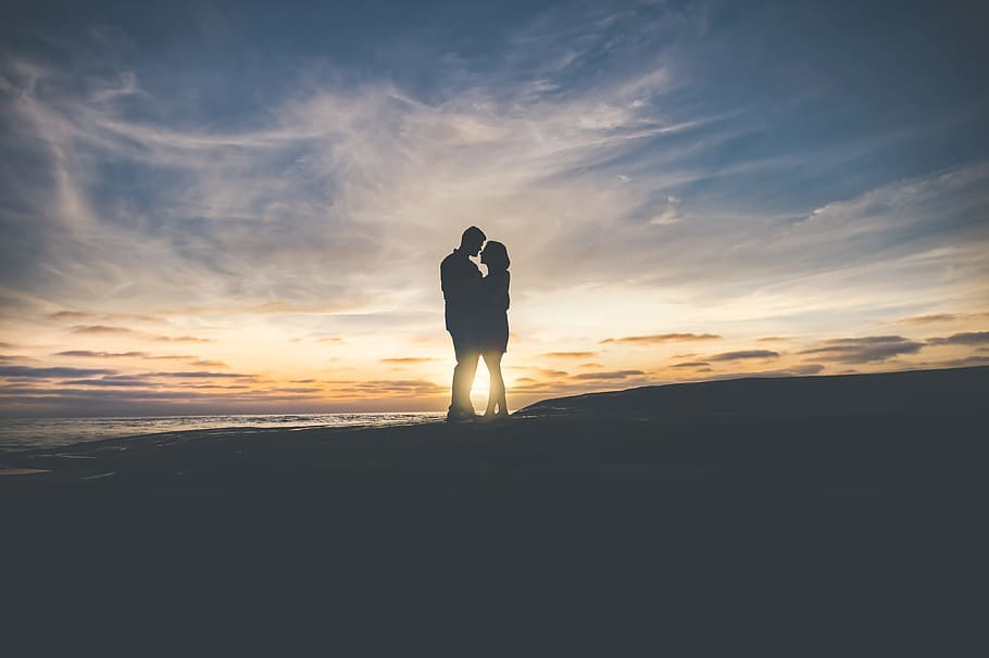 man and woman hugging each other, Lovers Entwined, sunset, dusk HD wallpaper