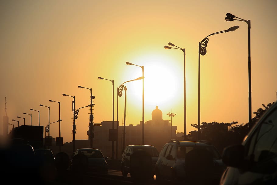 silhouette of parking post lamps, sunset, horizon, orange, sky HD wallpaper