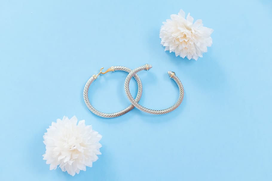 two silver-colored bangles, silver-colored hoop earrings with white clustered petaled flower HD wallpaper