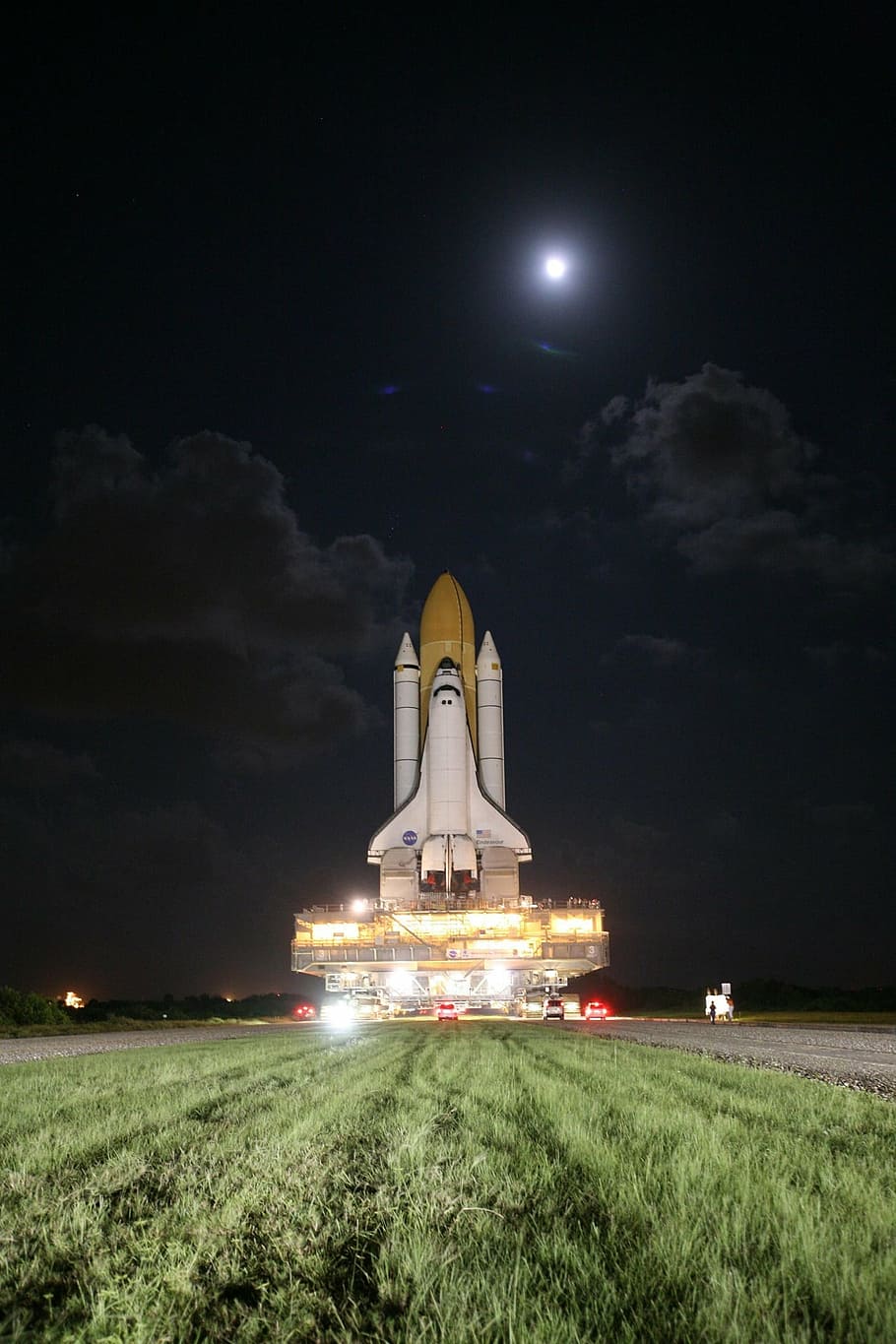 space shuttle on grass, rollout, moon, waning, stars, night, launch