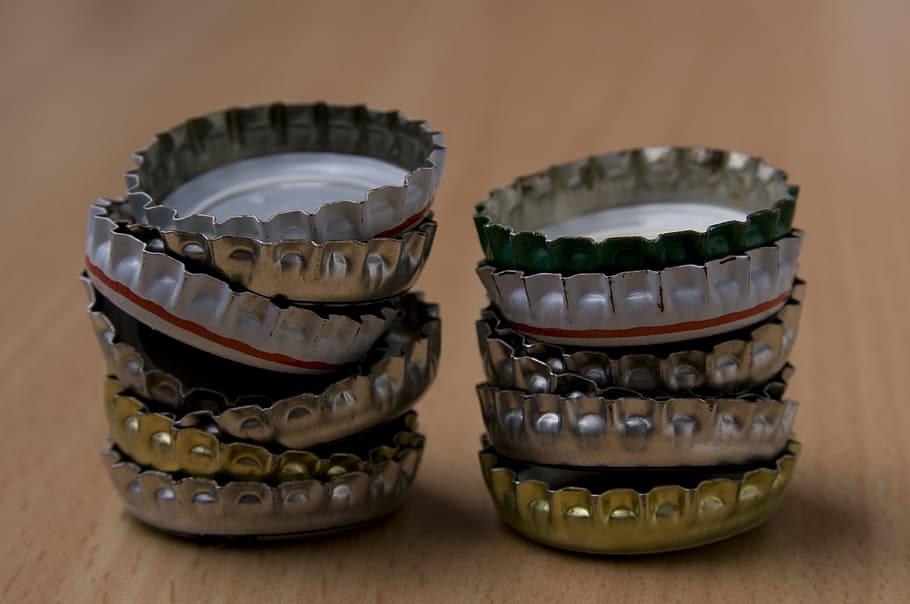 stacked of bottle caps, crown seals, crown caps, pile, crown corks HD wallpaper